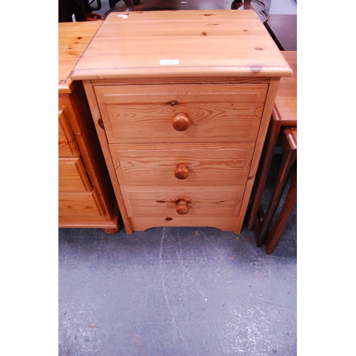 386 - Two modern pine three-drawer bedside chests.