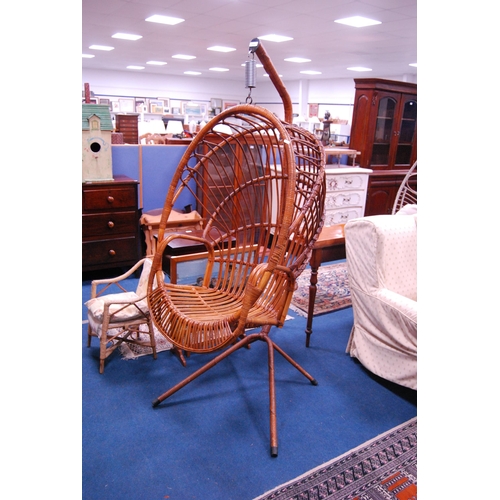 488 - Mid-century bamboo egg chair on suspension stand.