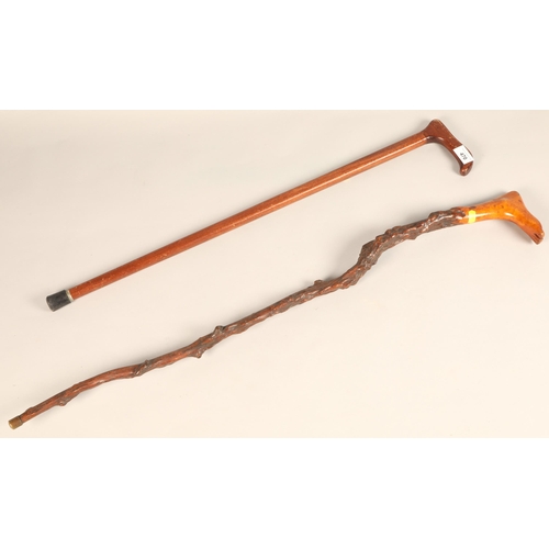 470 - Hardwood walking stick with handle in form of a foot, and another walking stick (2)