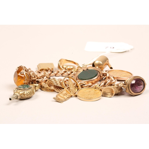 79 - 9ct gold bracelet with assorted charms and fobs including gold sovereign and gold half sovereign, to... 