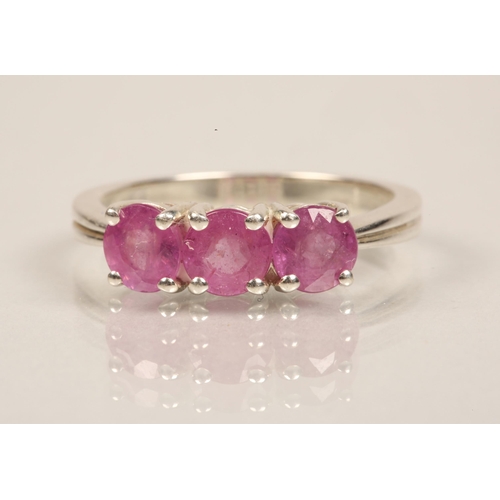 81 - Sterling silver ring set with a trio of pink gems