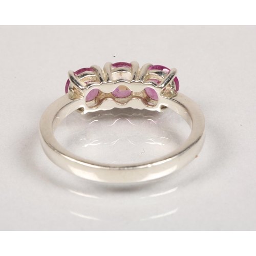 81 - Sterling silver ring set with a trio of pink gems