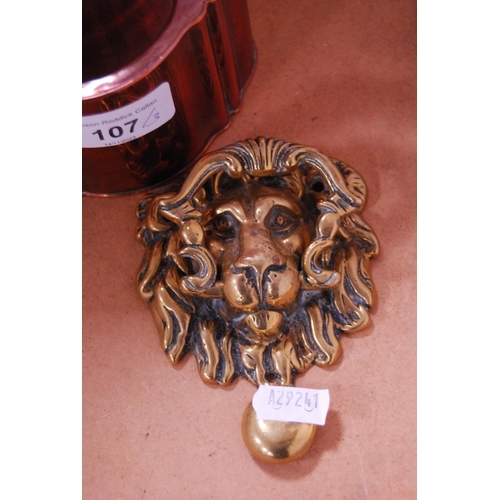 107 - Brass door knocker modelled as a lion mask, brass figure of a mythical child on a horse and a copper... 