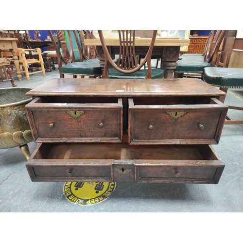 372 - 18th Century and later oak chest of drawers of low proportions with two deep drawers above two small... 