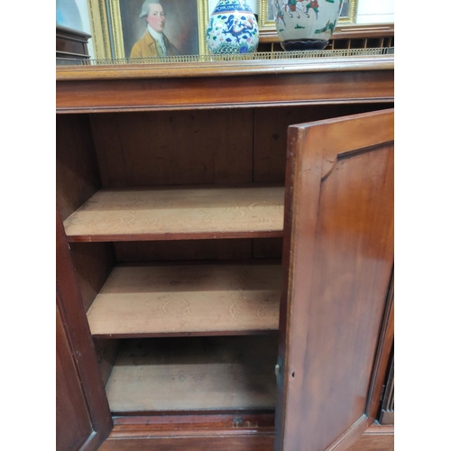 393 - Pair of 19th century Regency style mahogany side cabinets, the rectangular tops with pierced brass t... 