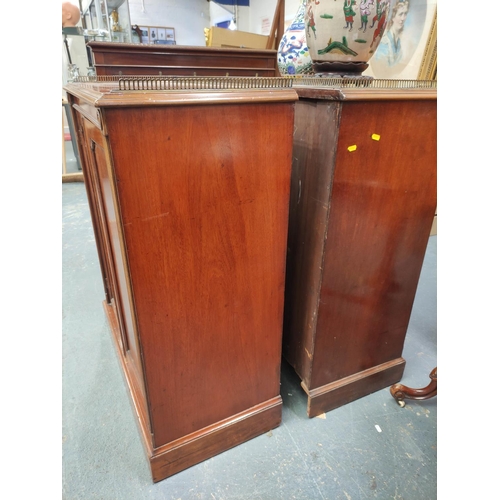 393 - Pair of 19th century Regency style mahogany side cabinets, the rectangular tops with pierced brass t... 