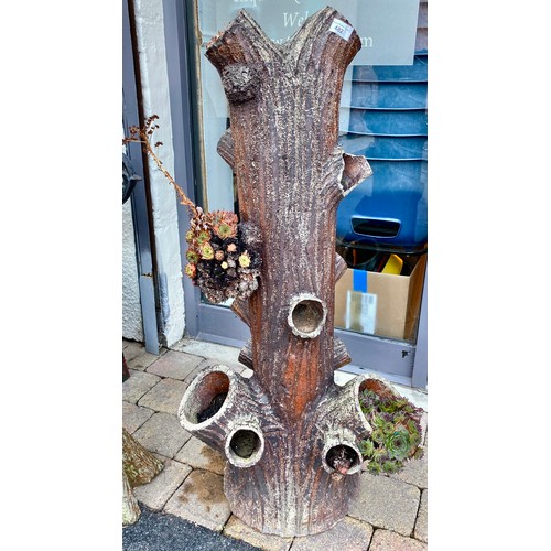 482 - Pair of concrete planters in the form of tree trunks (2)