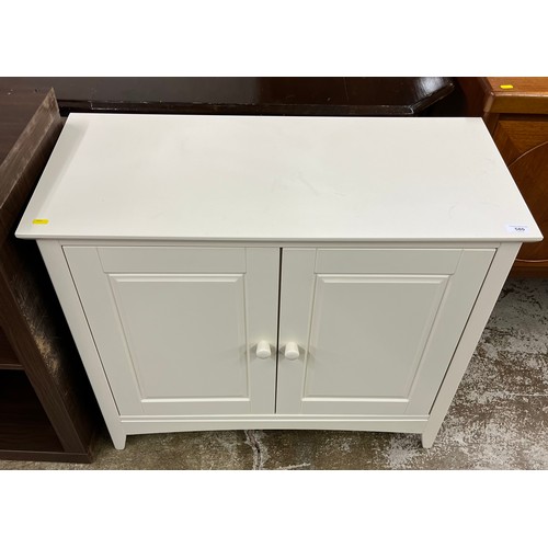 580 - White contemporary two door cupboard 73 x 40 x 87 cm 