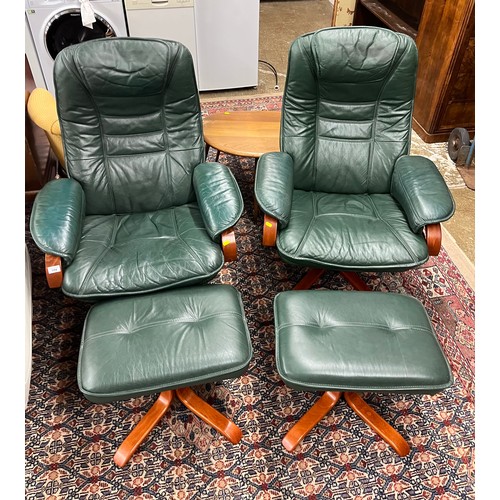 594 - Pair of green leather rotating arm chairs and foot stools (4)