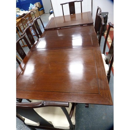 390 - Chinese hardwood dining table and a set of eight dining chairs, to include two carvers, the chairs w... 