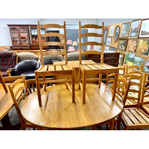 642 - Ercol pine extending dining table with eight chairs