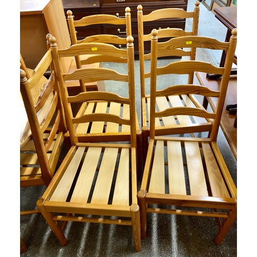 642 - Ercol pine extending dining table with eight chairs