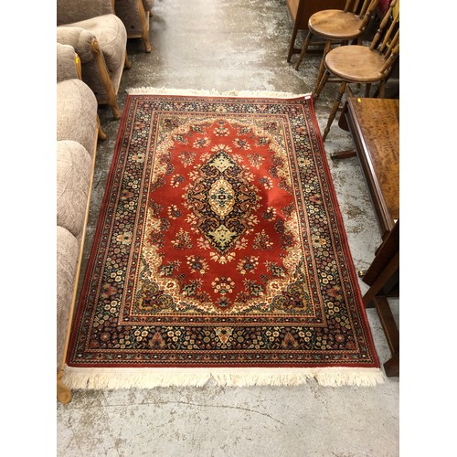 647 - Matching pair, one larger than other, red ground persian style rugs. 197 x 137 cm , 237 x 168 cm