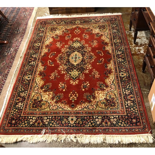 647 - Matching pair, one larger than other, red ground persian style rugs. 197 x 137 cm , 237 x 168 cm