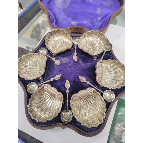 11 - Set of six silver scallop salts on dolphin feet, with spoons by Harry Atkin, Birmingham 1864, cased.... 