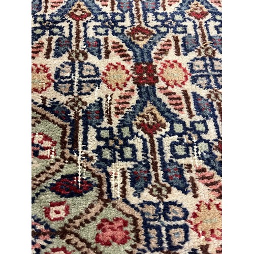 588 - Large woolen Sarab carpet, red and blue ground , 392 x 489 cm