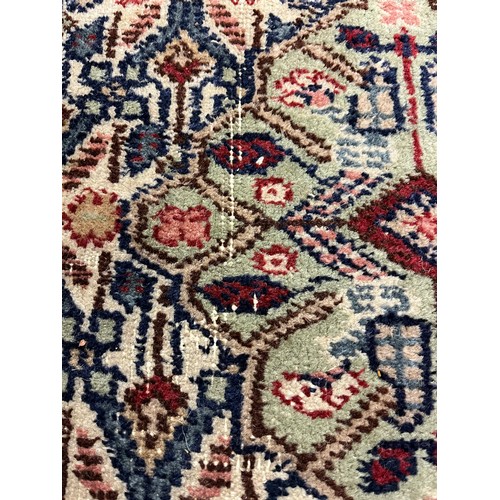 588 - Large woolen Sarab carpet, red and blue ground , 392 x 489 cm