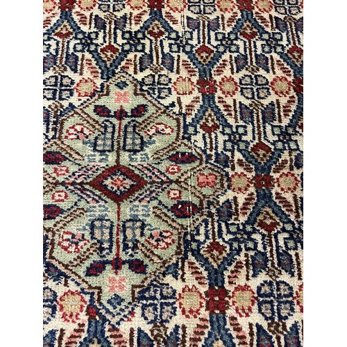 588 - Large woolen Sarab carpet, red and blue ground , 392 x 489 cm