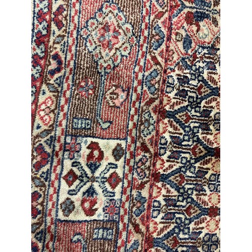 588 - Large woolen Sarab carpet, red and blue ground , 392 x 489 cm