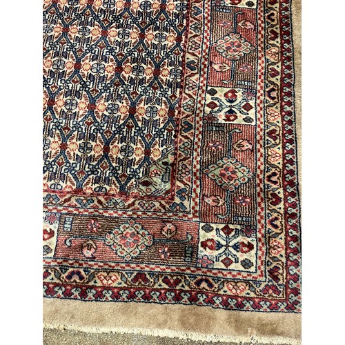 588 - Large woolen Sarab carpet, red and blue ground , 392 x 489 cm