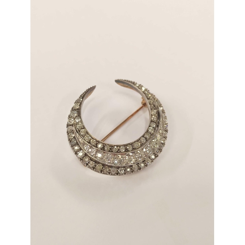 100 - Victorian diamond crescent brooch with three rows of typical old cut brilliants in gold fronted with... 