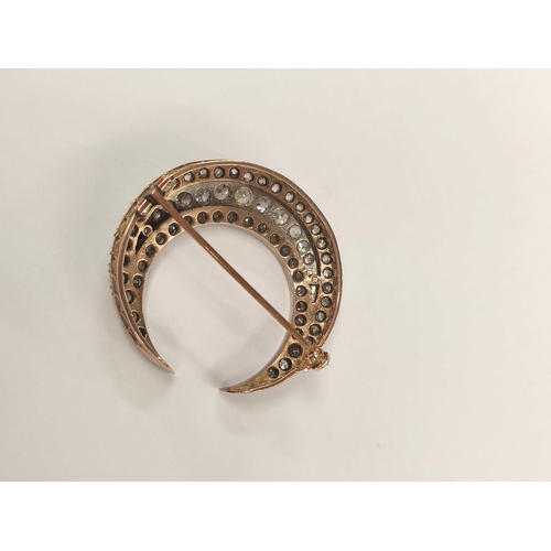 100 - Victorian diamond crescent brooch with three rows of typical old cut brilliants in gold fronted with... 