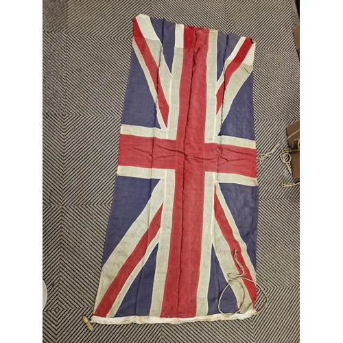 343 - Assortment of vintage flags possibly ship ensigns including eight vintage Union Jack flags, a large ... 