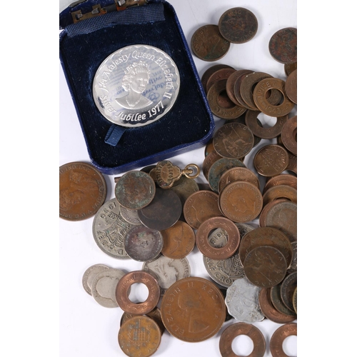 673 - Coins to include a John Pinches silver Jubilee 1977 silver medal 38g, in issue case, a Festival of B... 