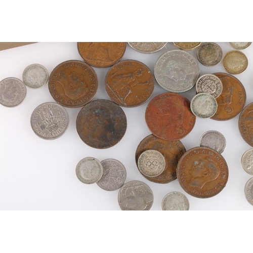 676 - Two WWI Princess Mary tobacco tins, and a small quantity of coins.