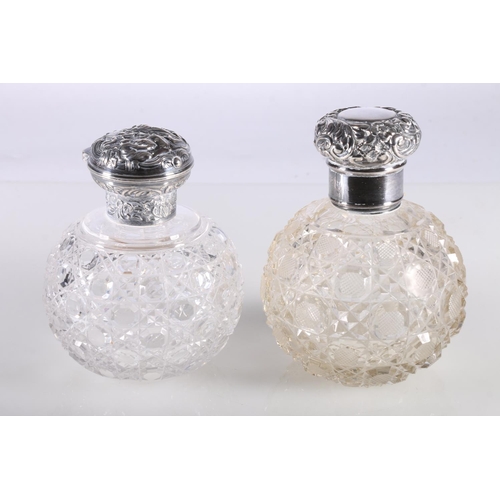 686 - Two silver mounted cut glass globular scent bottles, 13cm and 12cm high.