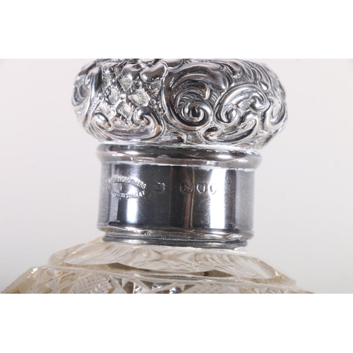 686 - Two silver mounted cut glass globular scent bottles, 13cm and 12cm high.