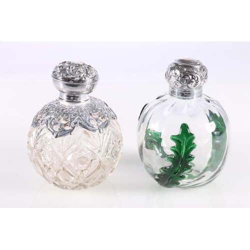 687 - Two silver mounted glass globular scent bottles, 11cm high.