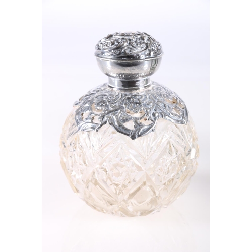 687 - Two silver mounted glass globular scent bottles, 11cm high.