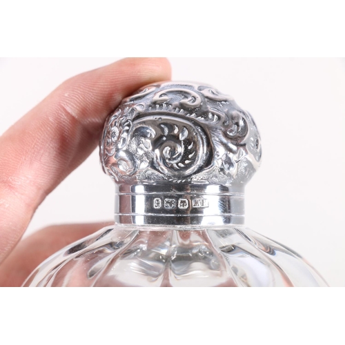 687 - Two silver mounted glass globular scent bottles, 11cm high.