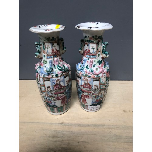 214A - Pair famille rose twin handled baluster vases, 25cm h