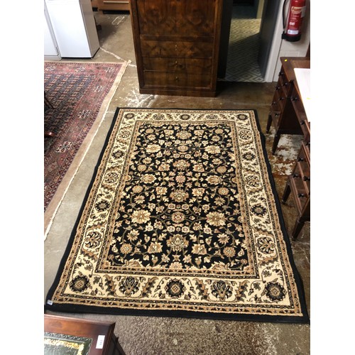 645 - Black & cream ground floral persian style rug