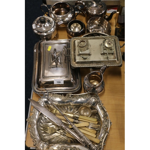 106 - Silver-plated items to include an entrée dish, flatware, a silver handled toasting fork, etc.