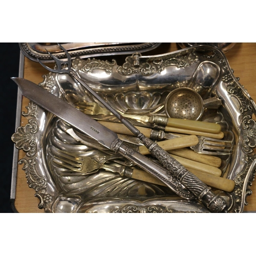 106 - Silver-plated items to include an entrée dish, flatware, a silver handled toasting fork, etc.