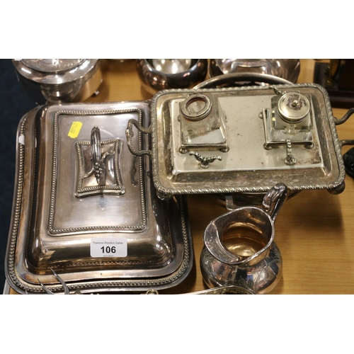 106 - Silver-plated items to include an entrée dish, flatware, a silver handled toasting fork, etc.