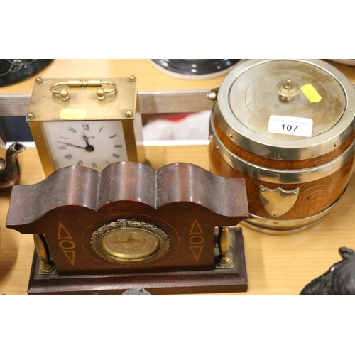 107 - Oak and silver-plated tobacco jar, a mahogany and brass mantle clock, and another.  (3)