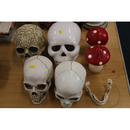 117 - Four decorative skull models and two toadstools.  (6)