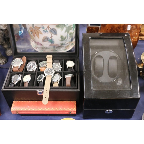 131 - Case containing replica wristwatches, and a watch display case.