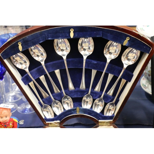 134 - Edwardian canteen of cutlery, in shaped mahogany box.