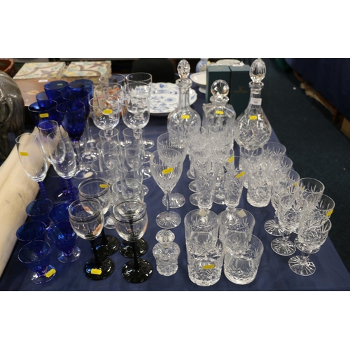 141 - Cut glassware to include an Edinburgh Crystal decanter, glasses, blue glasses, a scent bottle, etc.