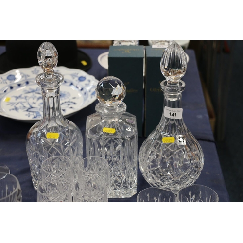 141 - Cut glassware to include an Edinburgh Crystal decanter, glasses, blue glasses, a scent bottle, etc.