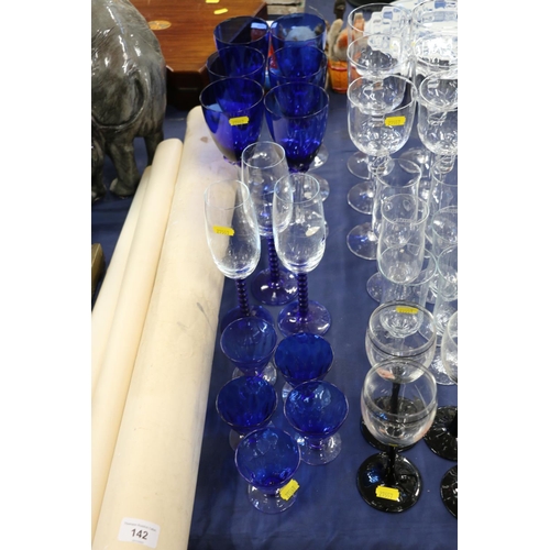 141 - Cut glassware to include an Edinburgh Crystal decanter, glasses, blue glasses, a scent bottle, etc.