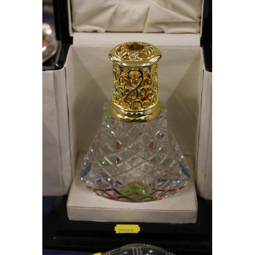 148 - Cut-glass scent bottle, in decorative hinged display box.