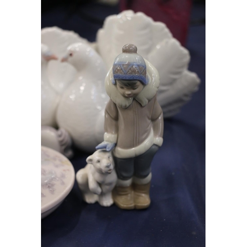 155 - Lladro to include a model of doves, a boy with bear and a trinket box.  (3)