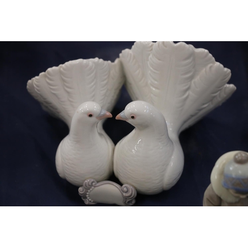 155 - Lladro to include a model of doves, a boy with bear and a trinket box.  (3)