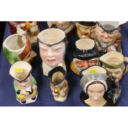 156 - Character jugs to include Charlie Chaplin, Royal Doulton, etc.  (15)